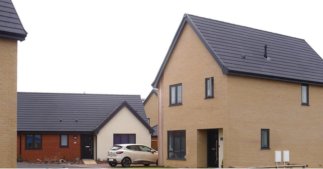 Completed homes — mix of brick and buff exteriors