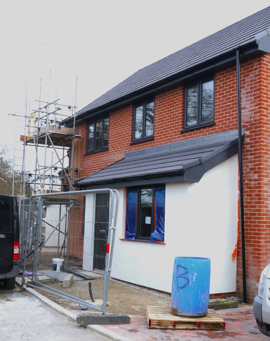 House with scaffolding — nearing completion