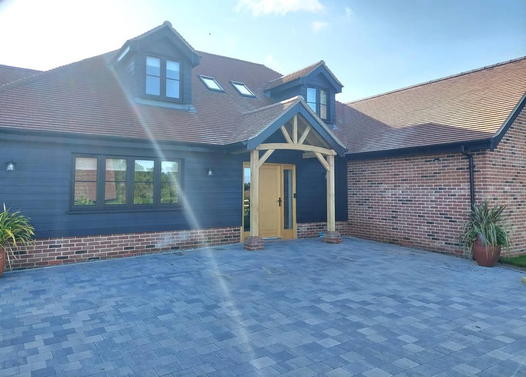 Stunning bespoke home with blue cladding and oak porch